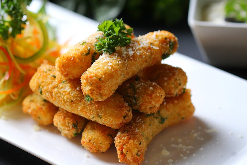 Golden Mozzarella Sticks with marinara sauce