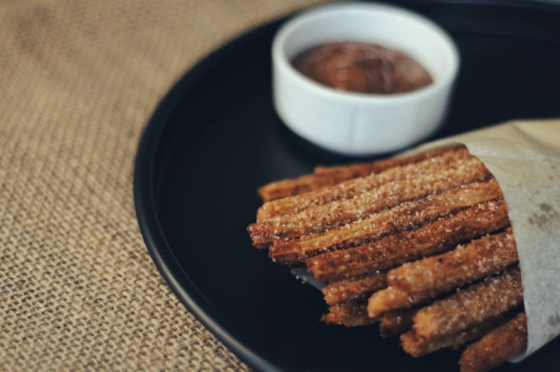Golden Churro Bites with dipping chocolate